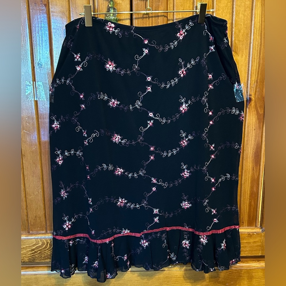 New with tags. Fashion Bug Black with embroidered stitching. Ruffled Hem